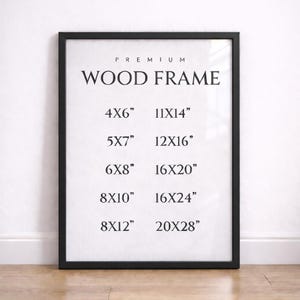 Puede incluir: Un marco de madera negro con el texto "PREMIUM WOOD FRAME" y opciones de tamaño: 10x15 cm, 13x18 cm, 15x20 cm, 20x25 cm, 20x30 cm, 28x35 cm, 30x40 cm, 40x50 cm, 40x60 cm y 50x70 cm.