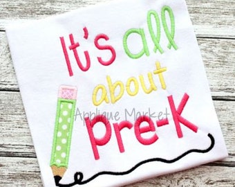 May include: A white t-shirt with the text "It's all about pre-k" in pink, green, and yellow lettering. A green and white polka dot pencil is drawn next to the text.