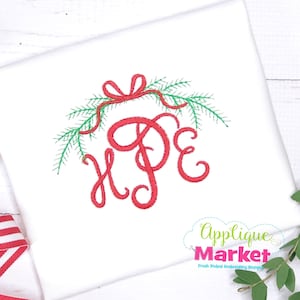 May include: Embroidered design of the word "Hope" in red cursive script with a red ribbon and green pine branches around it.