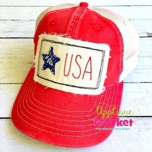 May include: Red and white trucker hat with a distressed fabric patch that says "USA" with a blue star on the left side.