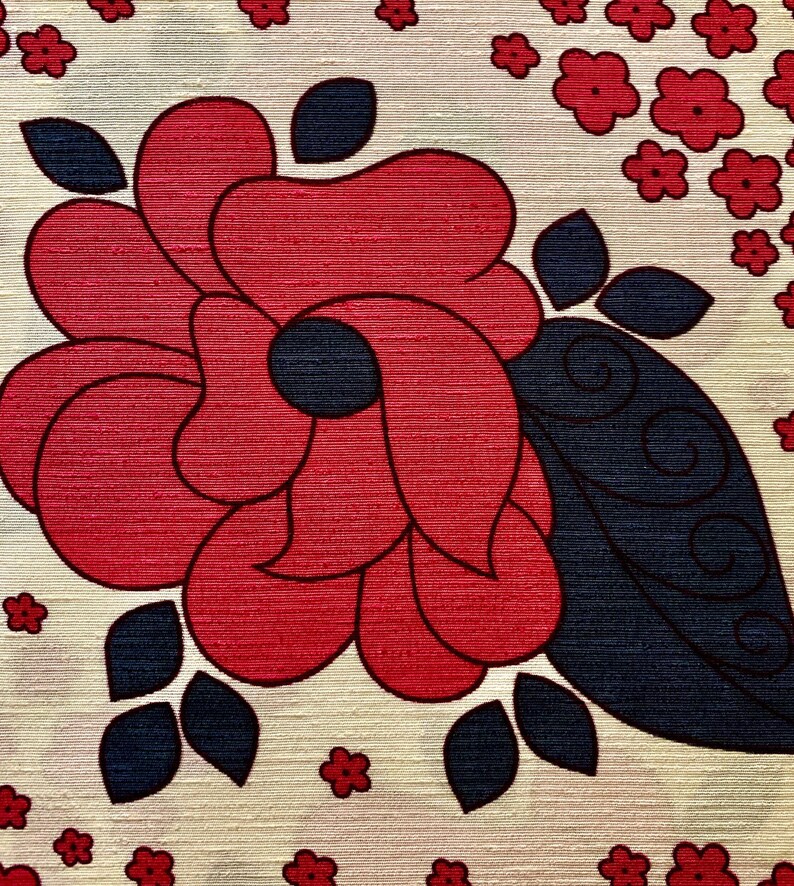 May include: A red and blue floral design on a cream background. The flower is stylized and has a large, rounded shape with a dark blue leaf.