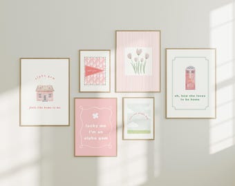 May include: A set of framed art prints with a delicate, pastel aesthetic. The prints showcase watercolour illustrations of a house, flowers, and a door, accompanied by positive text. The colour scheme includes soft pinks, greens, and whites, creating a warm and inviting atmosphere.