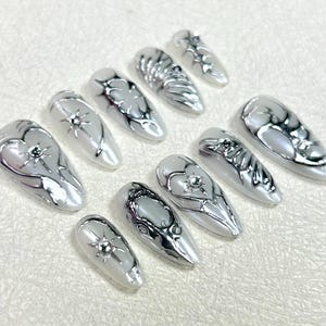 Mystical White Nails,Silver Enigmatic Patterns, Artistic Nails with High Quality, Y2K Inspired Nail Art, Silver Metallic Hand Painted Nails