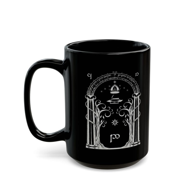 May include: Black ceramic mug with a white design of an archway with a tree on each side, a star, and the words "Not all those who wander are lost."