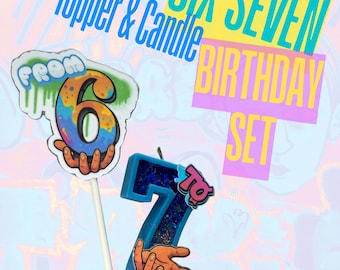 May include: A birthday set featuring a number 7 candle and a number 6 topper on a stick. The candle is blue with glitter, and the topper has a colorful design. Text reads "Six Seven Birthday Set."