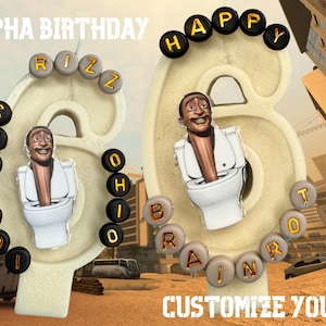 May include: A birthday-themed design featuring the text "ALPHA BIRTHDAY" and "CUSTOMIZE YOURS!". The design includes the numbers 6 and 8, each with a cartoon figure emerging from a toilet. The numbers are surrounded by letter beads spelling out various words.