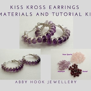 May include: A DIY kit for making earrings with a wire wrapped design. The kit includes amethyst, rose quartz, and garnet beads. The kit also includes instructions for making the earrings.