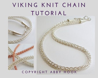 May include: A silver chain necklace with a Viking knit design. The necklace is shown in three different close-up views. The text "VIKING KNIT CHAIN TUTORIAL" and "COPYRIGHT ABBY HOOK" are visible in the image.