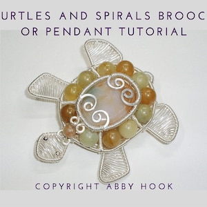 May include: A silver wire wrapped turtle pendant or brooch with a light pink, green, and brown stone in the centre. The turtle is surrounded by smaller green, brown, and yellow stones. The text "TURTLES AND SPIRALS BROOCH OR PENDANT TUTORIAL" is at the top of the image and "COPYRIGHT ABBY HOOK" is at the bottom.