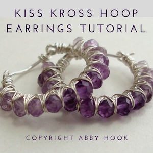 May include: A pair of silver hoop earrings with purple gemstone beads wrapped around the hoops. The earrings are called "Kiss Kross Hoop Earrings" and the image is labeled "Copyright Abby Hook".