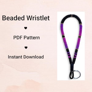 May include: A beaded wristlet in black, purple, and gold. The wristlet is made of small beads and has a loop for attaching keys or other items. The image includes the text "Beaded Wristlet", "PDF Pattern", and "Instant Download".