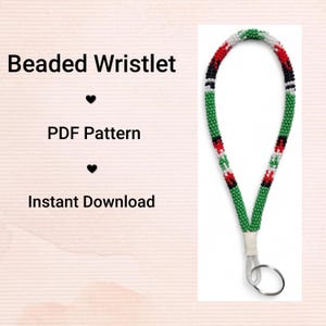 May include: A beaded wristlet featuring a pattern of green, red, black, and white beads. It is attached to a silver key ring. The text on the left reads "Beaded Wristlet", "PDF Pattern", and "Instant Download".