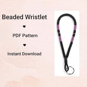 Peut inclure: Un bracelet de poignet perlé avec des perles noires et des sections roses. Le bracelet a une boucle noire et un anneau argenté. Le texte à gauche indique "Beaded Wristlet", "PDF Pattern" et "Instant Download".