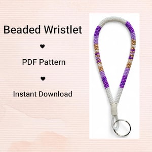 May include: A beaded wristlet featuring a pattern of white, purple, and gold beads. It has a white cord and a silver key ring. Text on the left side reads "Beaded Wristlet", "PDF Pattern", and "Instant Download".