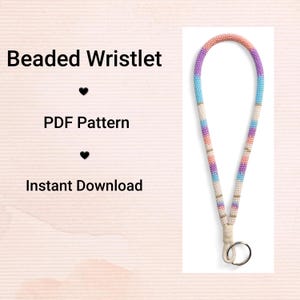 May include: A colourful beaded wristlet with a loop and key ring. The beads are in shades of pink, purple, blue, and white. The text "Beaded Wristlet", "PDF Pattern", and "Instant Download" are displayed on the left side of the image.