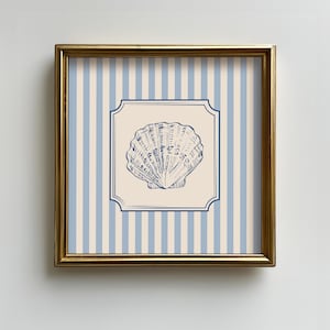 May include: A framed print with a blue seashell illustration on a cream background, set within a blue frame. The background has vertical blue and cream stripes, and the frame is gold. Ideal for coastal decor.
