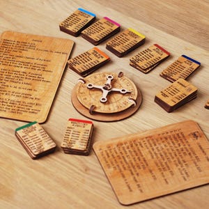 May include: A wooden board game with a wooden spinner and cards. The cards are labeled with different locations, such as "Boardwalk" and "Kentucky Avenue". The game also includes a wooden wheel with a pointer.