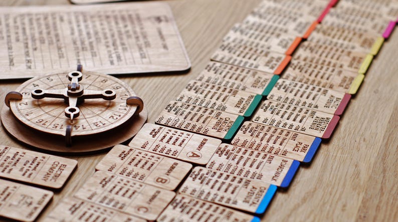 May include: A wooden game board with a variety of cards and a spinning wheel. The cards are labeled with different properties, such as "Avenue", "Park Place", and "Boardwalk". The spinning wheel is used to determine the number of spaces a player moves.
