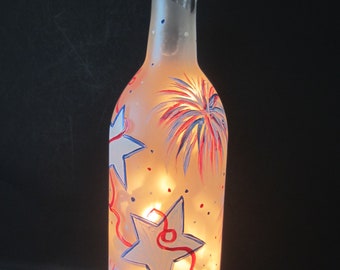 Stars, Ribbon, and Fireworks  on this Patriotic  Frosted Lighted Bottle**** Hand Painted Bottle** Electric Lights**