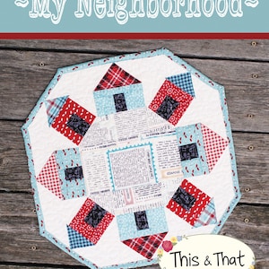 May include: A quilt pattern titled "My Neighborhood" with a design of houses in red, blue and white fabrics. The pattern is by This & That, Original Quilt Patterns by Sherri K. Falls. The pattern number is #286.