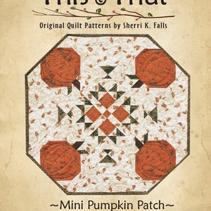 Könnte beinhalten: Ein Quiltmuster mit dem Titel "This & That" von Sherri K. Falls, mit einem Mini-Kürbisfeld-Design. Das Muster ist mit #185 nummeriert.