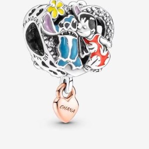 May include: A silver charm with a heart-shaped design featuring the characters Stitch and Lilo from the Disney movie Lilo & Stitch. The charm has a rose gold heart pendant that says "OHANA".