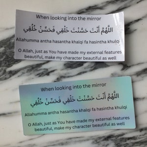 May include: Two cards with a light blue and purple gradient background. The cards have the same text in Arabic and English. The text reads: "When looking into the mirror, Allahumma antha hasantha khalqi fa hasintha khulqi. O Allah, just as You have made my external features beautiful, make my character beautiful as well."