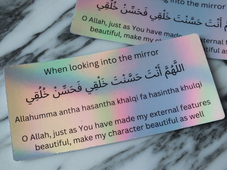May include: A colorful card with an Islamic prayer in Arabic script and English translation. The prayer asks Allah to make the person's character as beautiful as their physical features. The card is perfect for self-reflection and affirmation.
