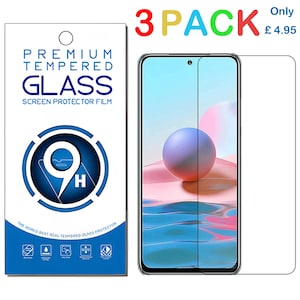 May include: A pack of three screen protectors for a smartphone. The packaging on the left displays the text "PREMIUM TEMPERED GLASS SCREEN PROTECTOR FILM". A phone screen with a protector applied is visible.