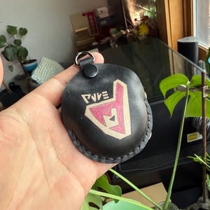 Black dyed leather with painted character/logo option on Go Plus+ Sleeve.