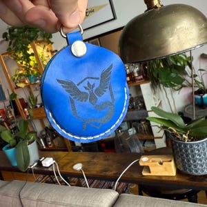 Blue dyed leather with the engraved character/logo option.