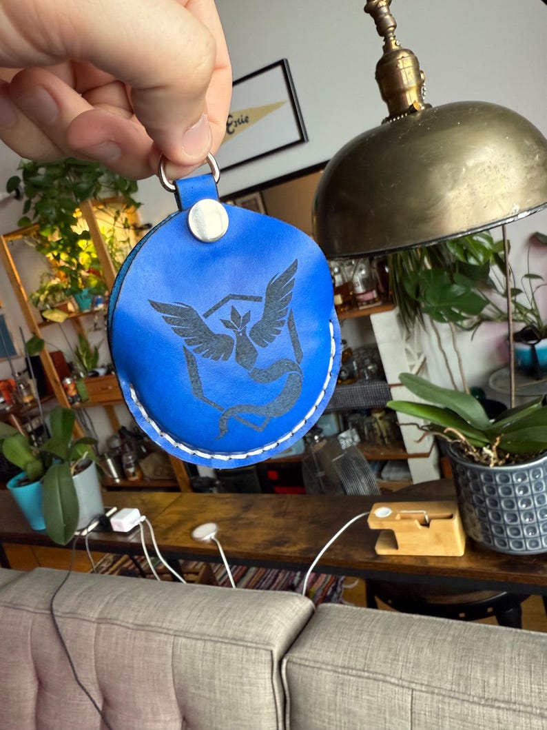 Blue dyed leather with the engraved character/logo option.