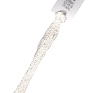 May include: A skein of white embroidery floss with a label that reads "Silken Pearl".