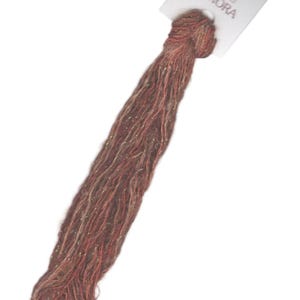 May include: A skein of Aurora brand embroidery floss in a reddish-brown color with gold metallic thread woven throughout.