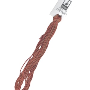 May include: A skein of red and brown embroidery floss with a white label that reads "The Thread Gatherer Silk 'n Colors".