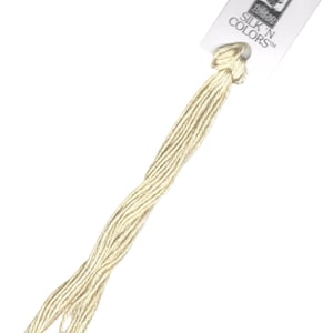 May include: A skein of cream-coloured embroidery floss with a white label that reads "SILK 'N COLORS™" and a small image of a bird.