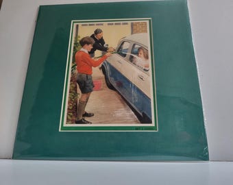 A vintage green Ladybird picture card depicting the "Car washing" art by Ladybird artist Harry Wingfield.