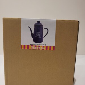 May include: A cardboard box with a sticker featuring a dark purple teapot with a long spout and handle. The sticker also includes the text "Valley of Witches" and Japanese text.