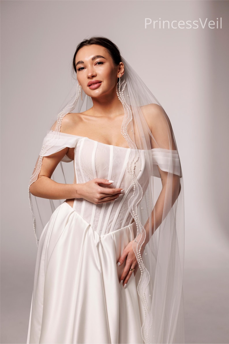 Elegant Wedding veil with pearl trim. This single-tier veil is decorated with high-quality pearls of various sizes . image 7