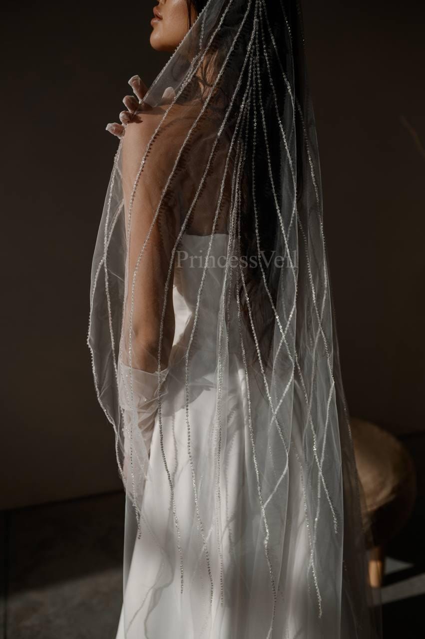 Long one tier wedding veil with beads and sequins, decorated with beaded stripes from the crest, single row cathedral veil with embroidery