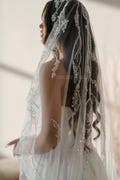 Modern veil with lace silver trim with embroidery, from the comb and the bottom of the veil. This single layer product logo