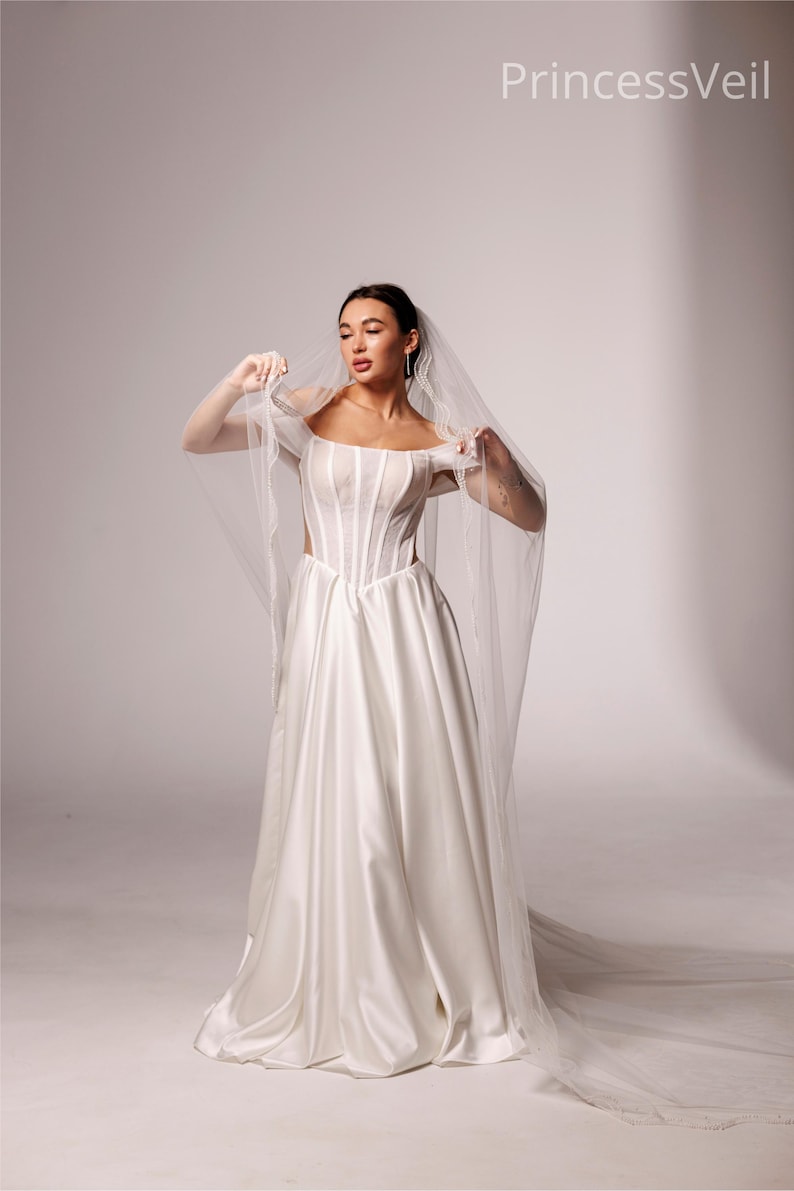 Elegant Wedding veil with pearl trim. This single-tier veil is decorated with high-quality pearls of various sizes . image 14