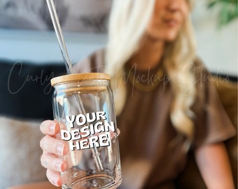 May include: A clear glass tumbler with a bamboo lid and a straw. The tumbler has a white sticker that says "YOUR DESIGN HERE".