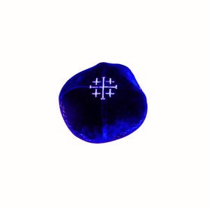 May include: A blue velvet kippah with a white embroidered cross.