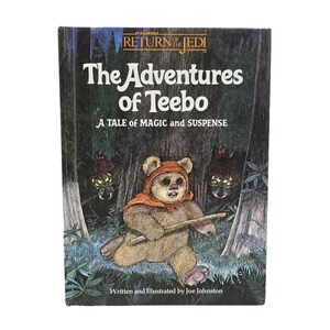 May include: A vintage Star Wars book titled "The Adventures of Teebo." The cover features an Ewok character in a hooded outfit, holding a stick, set against a forest backdrop. The book is written and illustrated by Joe Johnston.