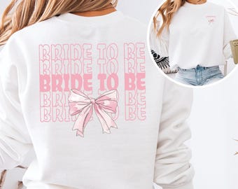 Blivande brudtröja, kokett, rosett, brudtröja, rosa rosetter, rund hals, framtida fru-tröja, present till bruddusch, bröllopsdagspresenter, fästmö-tröja