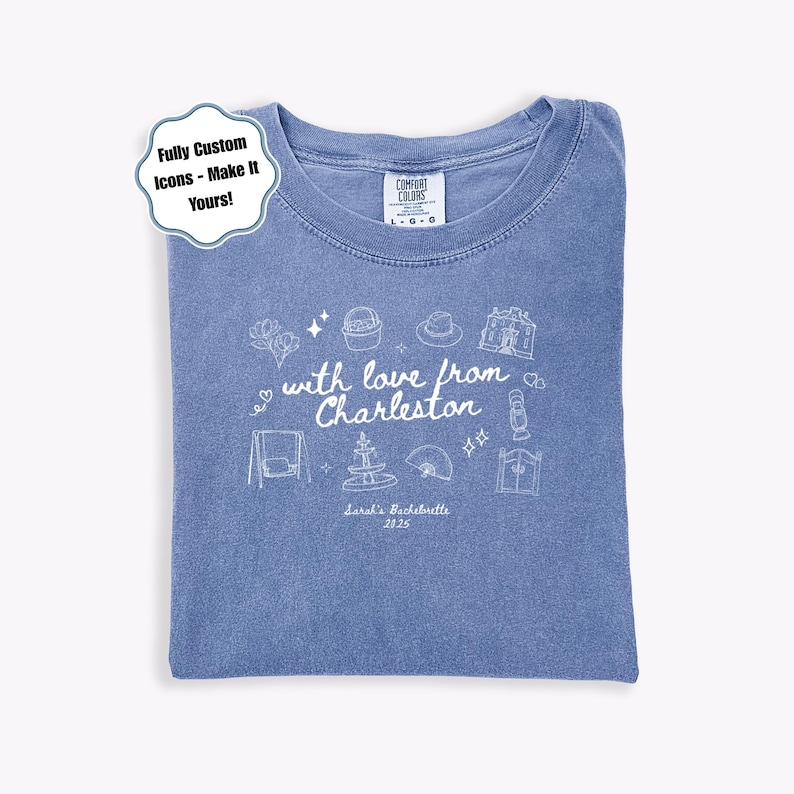 May include: A blue Comfort Colors t-shirt with a crew neck, featuring white line art and text that reads "with love from Charleston." The design includes icons and the text "Sarah's Bachelorette 2825."