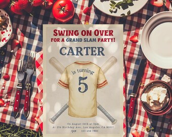 May include: Baseball-themed party invitation with the text "Swing on Over for a Grand Slam Party!" and "Carter is turning 5." The invitation features a baseball jersey and crossed bats. The invitation is on a picnic table with food.