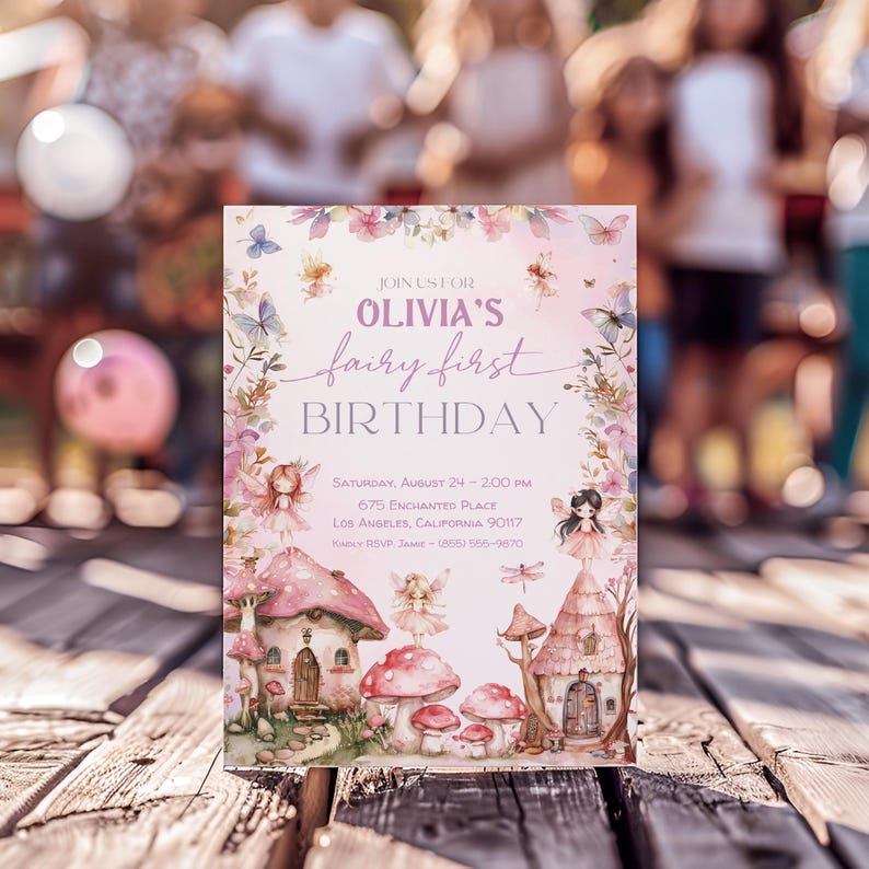 May include: A pink and purple fairy-themed birthday invitation with a watercolor background. The invitation features a whimsical illustration of a fairy house, mushrooms, and butterflies. The text reads "Join us for Olivia's fairy first birthday." The invitation also includes the date, time, and location of the party.