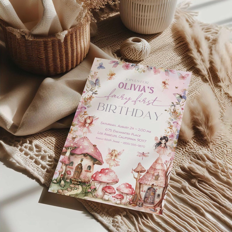 May include: A pink and purple fairy-themed birthday invitation with a watercolor illustration of a fairy village, mushrooms, and butterflies. The text reads "Join us for Olivia's fairy first birthday. Saturday, August 24 - 2:00 PM, 675 Enchanted Place, Los Angeles, California 90117. Kwily RSVP: (855) 555-9670."